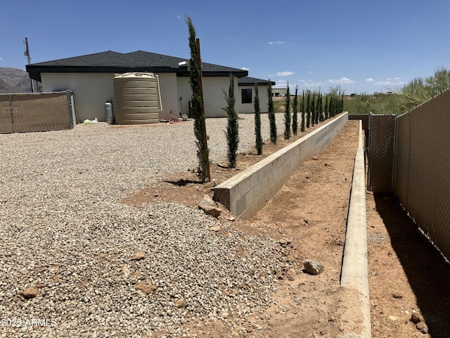 4079 E Roosevelt St, Apache Junction, AZ 85119 - view of side of home featuring a fenced backyard and stucco siding