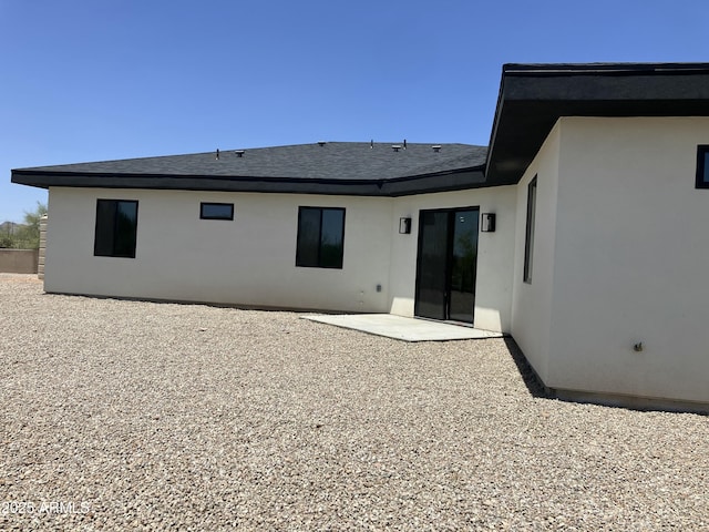 4079 E Roosevelt St, Apache Junction, AZ 85119 - back of house featuring a patio area, stucco siding, and a shingled roof