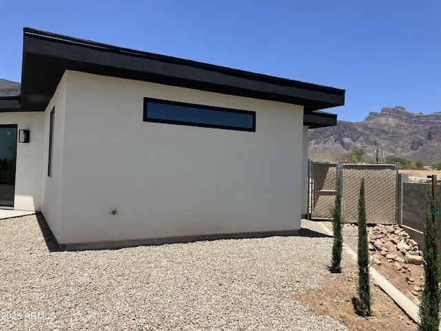 4079 E Roosevelt St, Apache Junction, AZ 85119 - view of side of property featuring a mountain view and stucco siding