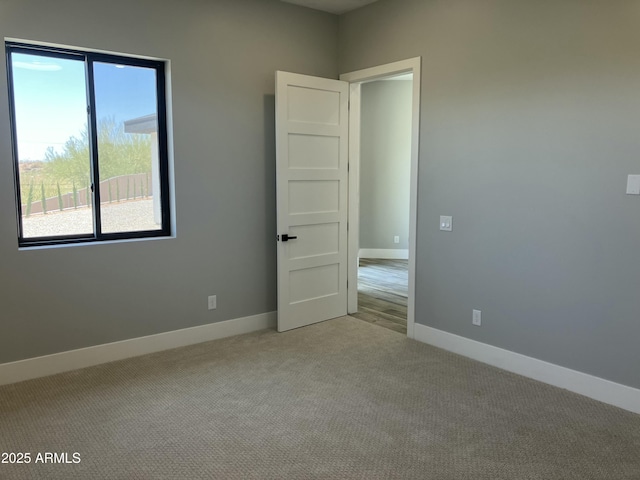 4079 E Roosevelt St, Apache Junction, AZ 85119 - empty room featuring carpet flooring and baseboards