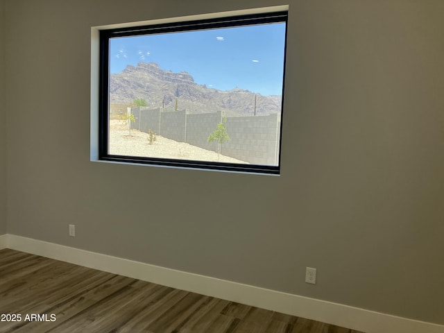 4079 E Roosevelt St, Apache Junction, AZ 85119 - spare room with wood finished floors and a mountain view