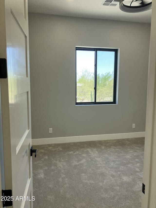 4079 E Roosevelt St, Apache Junction, AZ 85119 - carpeted spare room featuring baseboards