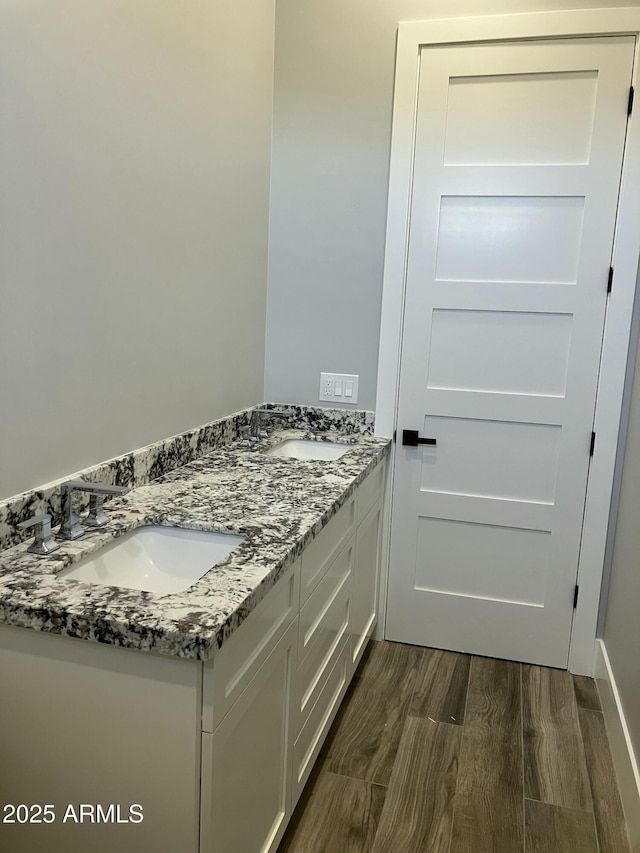 4079 E Roosevelt St, Apache Junction, AZ 85119 - bathroom with double vanity and wood finished floors