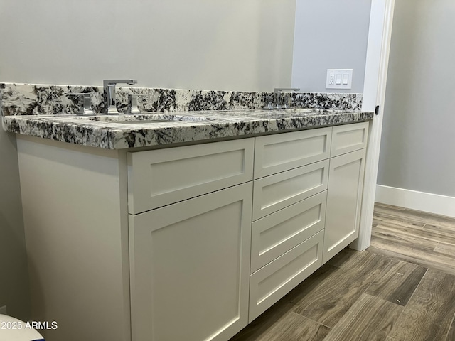 4079 E Roosevelt St, Apache Junction, AZ 85119 - bathroom with wood finished floors and double vanity