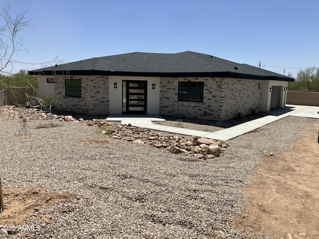 4079 E Roosevelt St, Apache Junction, AZ 85119 - view of front of house with brick siding, an attached garage, and a shingled roof