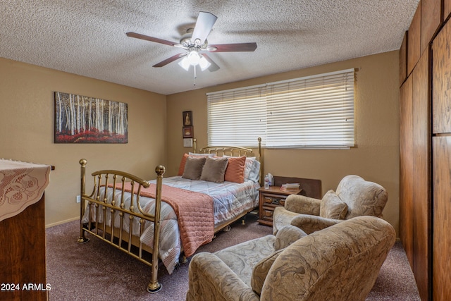 carpeted bedroom featuring ceiling fan and a textured ceiling