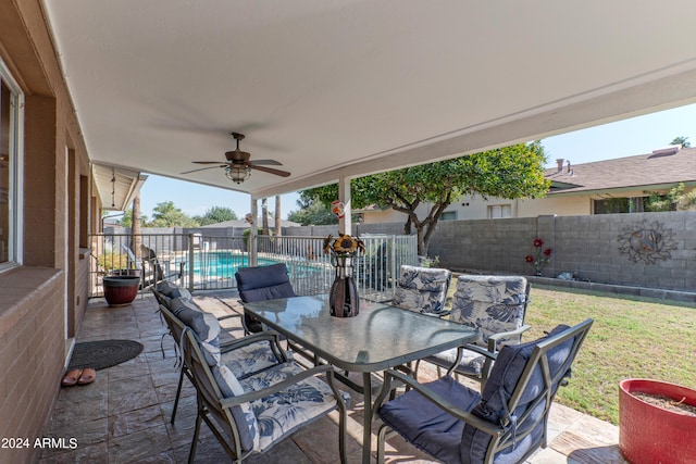 view of patio featuring ceiling fan