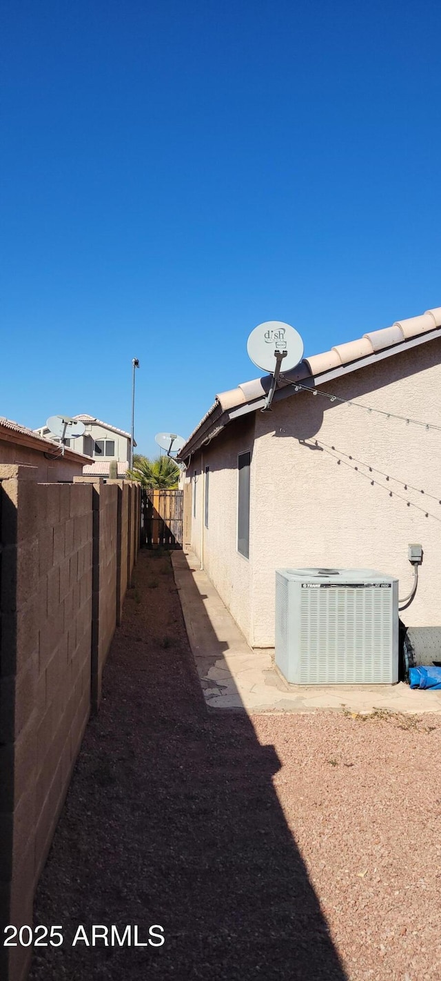 view of yard with central AC