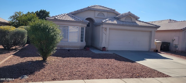 view of front of property with a garage