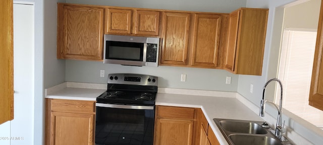 kitchen featuring black electric range and sink