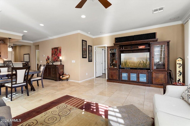 living room featuring ceiling fan and ornamental molding