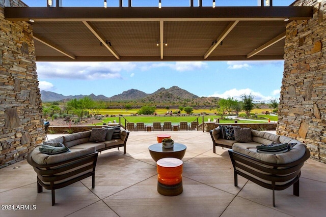 view of patio featuring a mountain view and outdoor lounge area