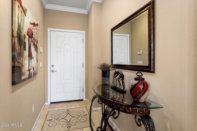 tiled foyer with ornamental molding