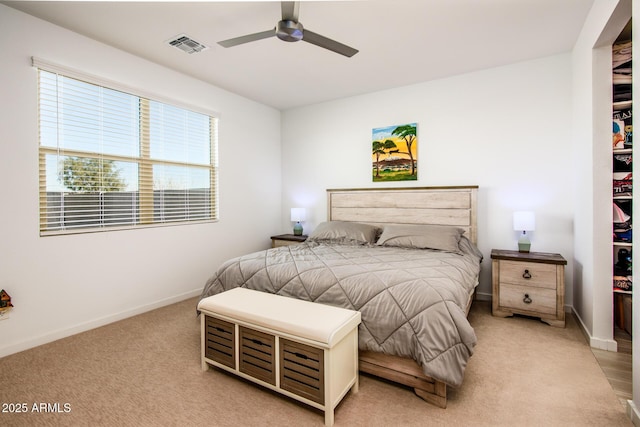 bedroom with ceiling fan and light colored carpet