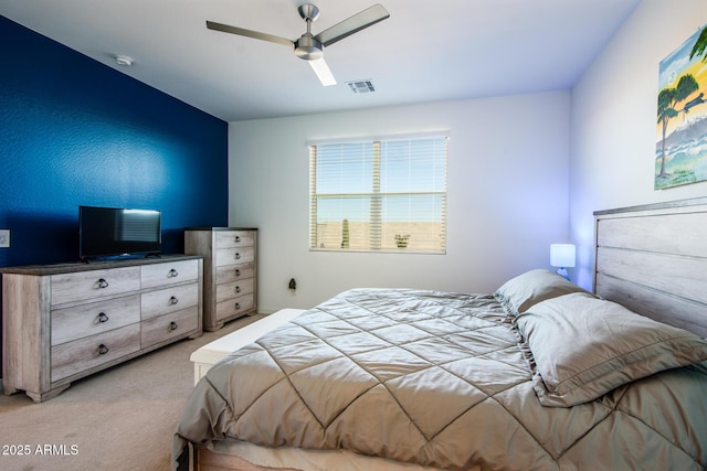 bedroom with ceiling fan and light colored carpet