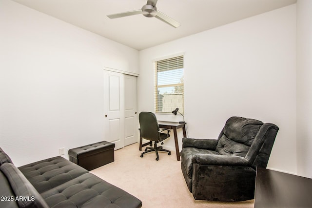 office area featuring ceiling fan and light colored carpet