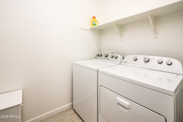 laundry room featuring washer and clothes dryer