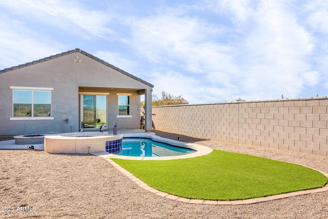 view of swimming pool with a patio and a hot tub