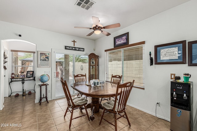 dining area featuring ceiling fan and light tile floors