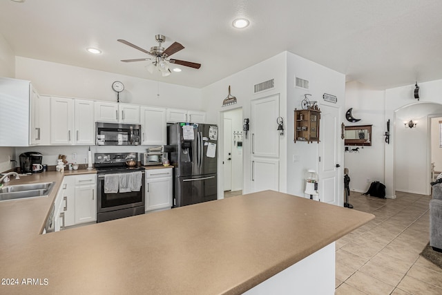 kitchen featuring white cabinetry, appliances with stainless steel finishes, sink, light tile floors, and ceiling fan