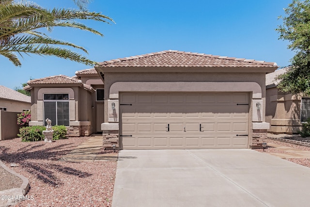 mediterranean / spanish-style house featuring a garage