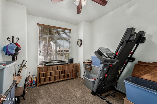 workout area with ceiling fan and carpet floors