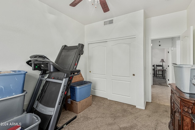 interior space with ceiling fan and carpet floors