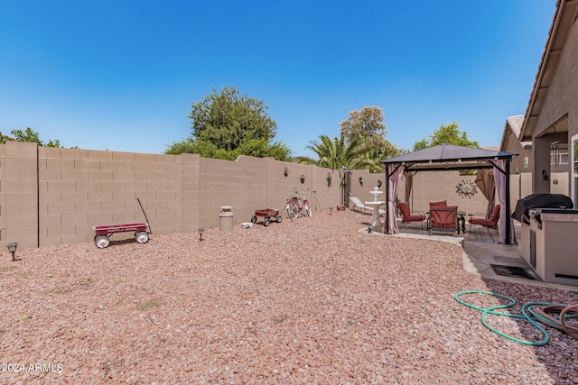 view of yard with a gazebo and a patio