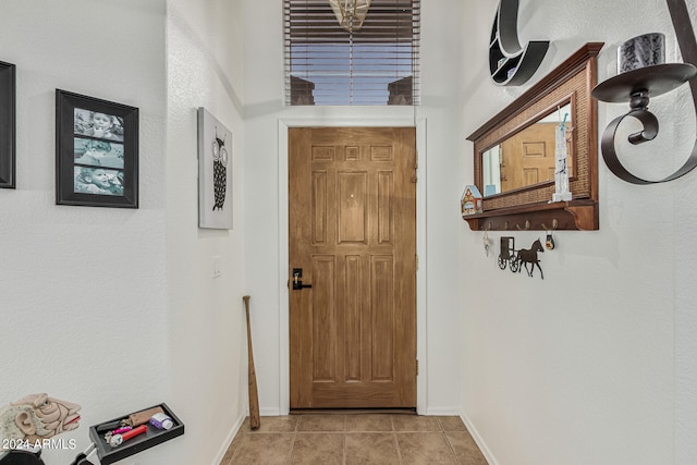 doorway featuring light tile floors