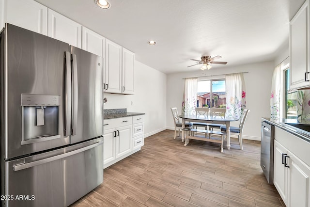 15019 W Banff Ln, Surprise, AZ 85379 - kitchen featuring stainless steel appliances, ceiling fan, white cabinetry, light wood-style floors, and recessed lighting