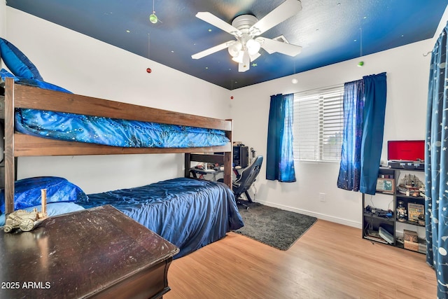 15019 W Banff Ln, Surprise, AZ 85379 - bedroom with wood finished floors and ceiling fan