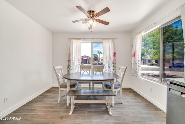 15019 W Banff Ln, Surprise, AZ 85379 - dining space with plenty of natural light, a ceiling fan, and wood finished floors
