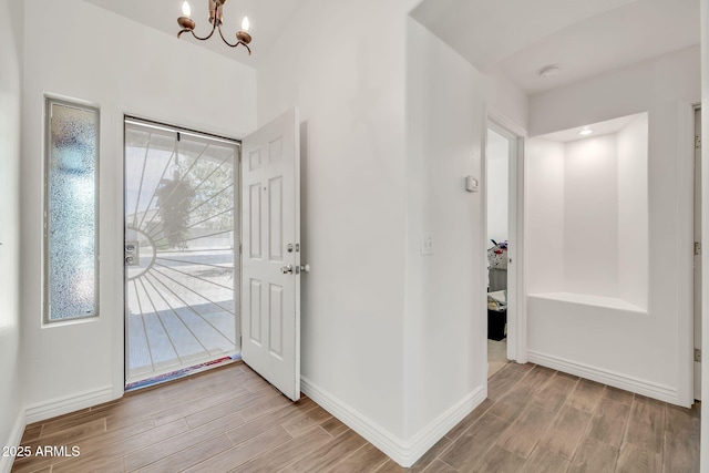 15019 W Banff Ln, Surprise, AZ 85379 - entrance foyer with wood finished floors and a chandelier