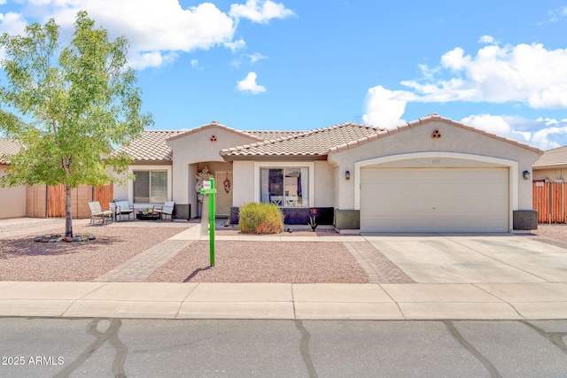 15019 W Banff Ln, Surprise, AZ 85379 - mediterranean / spanish house featuring stucco siding, driveway, a garage, and a tiled roof