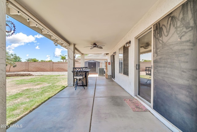 15019 W Banff Ln, Surprise, AZ 85379 - fenced backyard with a storage unit, a patio area, and ceiling fan
