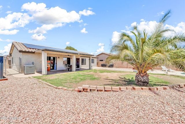 15019 W Banff Ln, Surprise, AZ 85379 - rear view of property with a gate, roof mounted solar panels, a patio, stucco siding, and ceiling fan