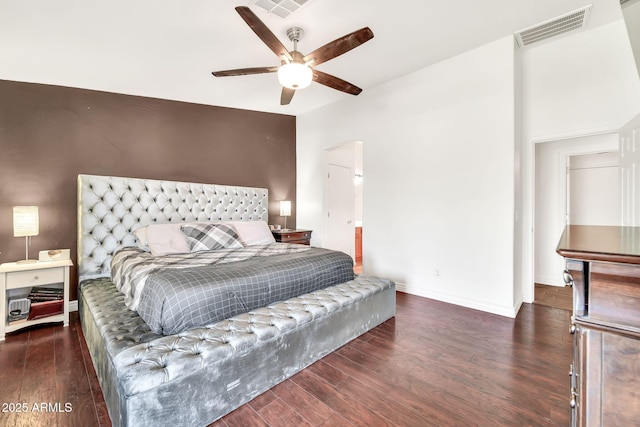 15019 W Banff Ln, Surprise, AZ 85379 - bedroom featuring wood finished floors, a ceiling fan, and arched walkways