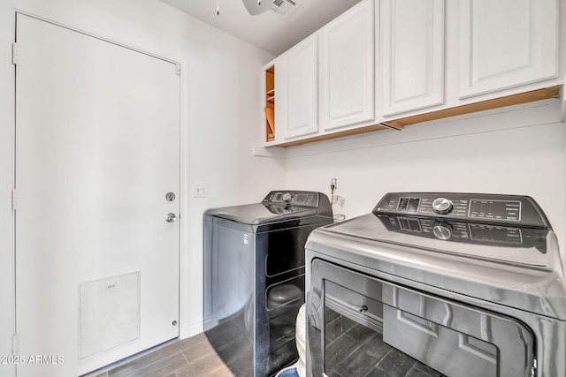 15019 W Banff Ln, Surprise, AZ 85379 - washroom featuring cabinet space, independent washer and dryer, and wood finished floors
