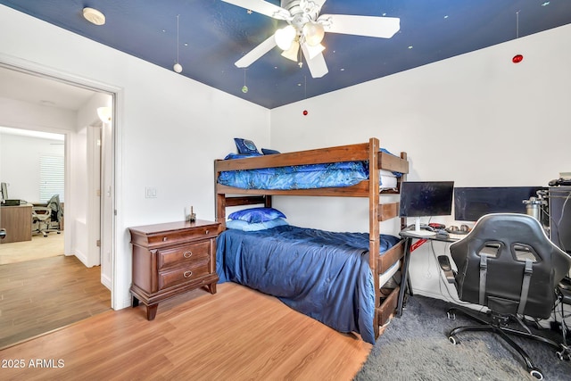 15019 W Banff Ln, Surprise, AZ 85379 - bedroom with wood finished floors, an office area, and a ceiling fan