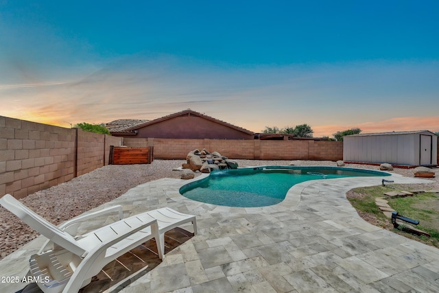15019 W Banff Ln, Surprise, AZ 85379 - view of pool featuring a fenced backyard, a patio, and a storage shed