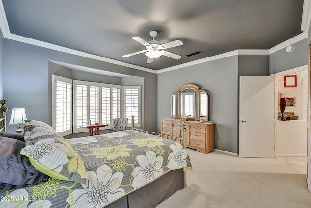 carpeted bedroom with visible vents, a ceiling fan, and ornamental molding