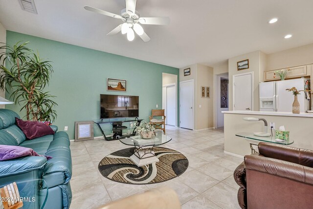 living room featuring a ceiling fan, recessed lighting, visible vents, and baseboards