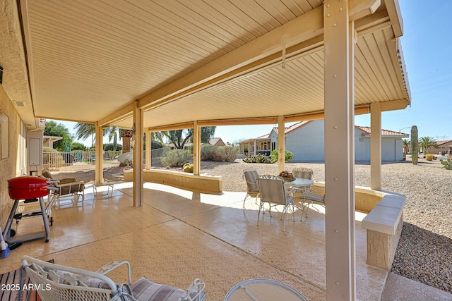 view of patio / terrace featuring outdoor dining space and fence