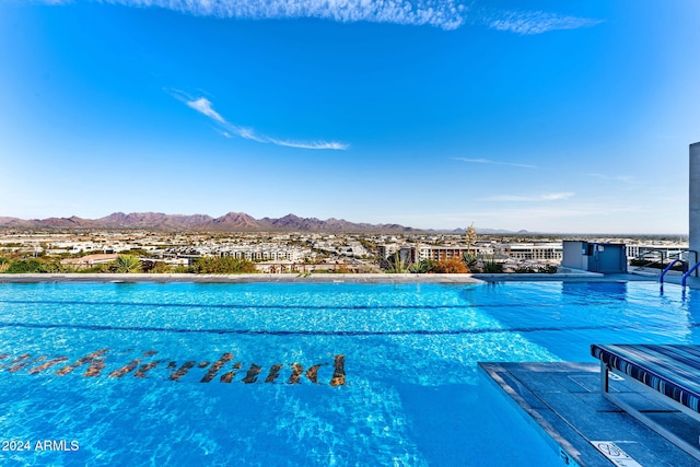 view of swimming pool featuring a mountain view