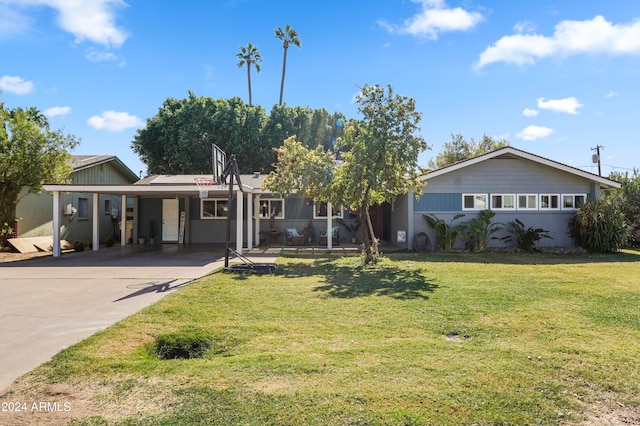 ranch-style house featuring a front yard and a carport