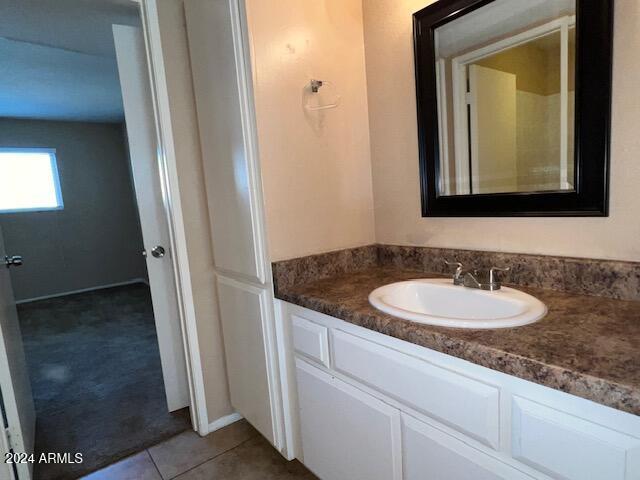 bathroom with vanity and tile patterned flooring