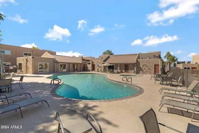 view of swimming pool with a patio area