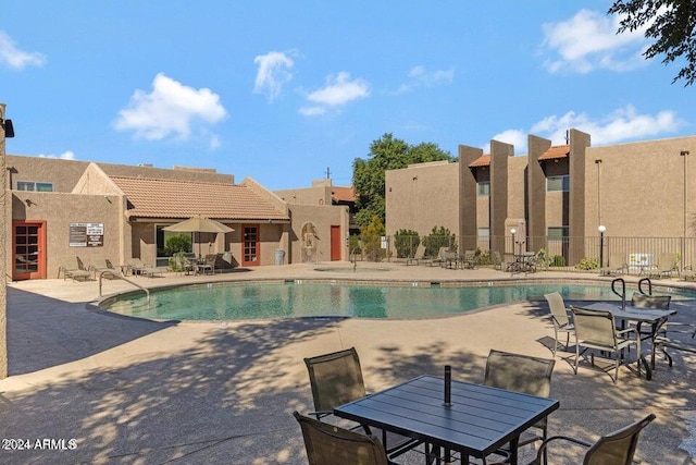 view of swimming pool with a patio area