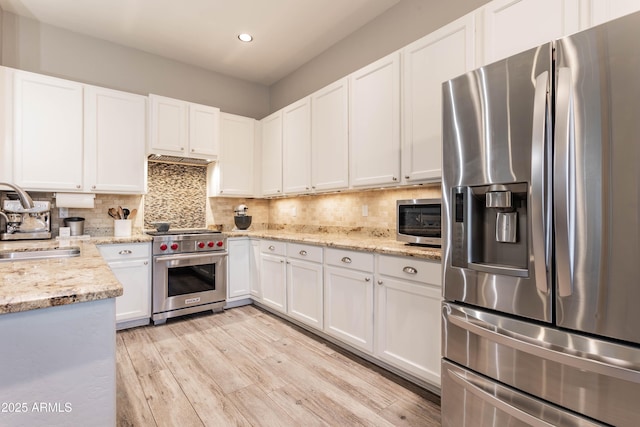 4422 E Spur Dr, Cave Creek, AZ 85331 - kitchen with stainless steel appliances, a sink, recessed lighting, and white cabinets