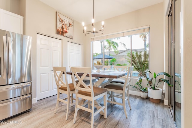 4422 E Spur Dr, Cave Creek, AZ 85331 - dining space featuring a chandelier, light wood-style floors, and baseboards